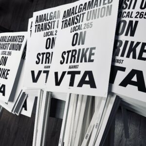 Picket signs say "ATU Local 265 on strike against VTA" in black and white. Source: ATU Local 265